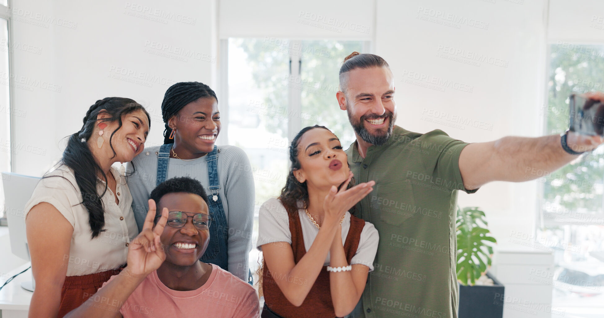 Buy stock photo Group selfie, hand gesture and business people in office taking pictures for social media. Comic face, blowing kiss and friends, men and women with peace sign taking photo together for happy memory