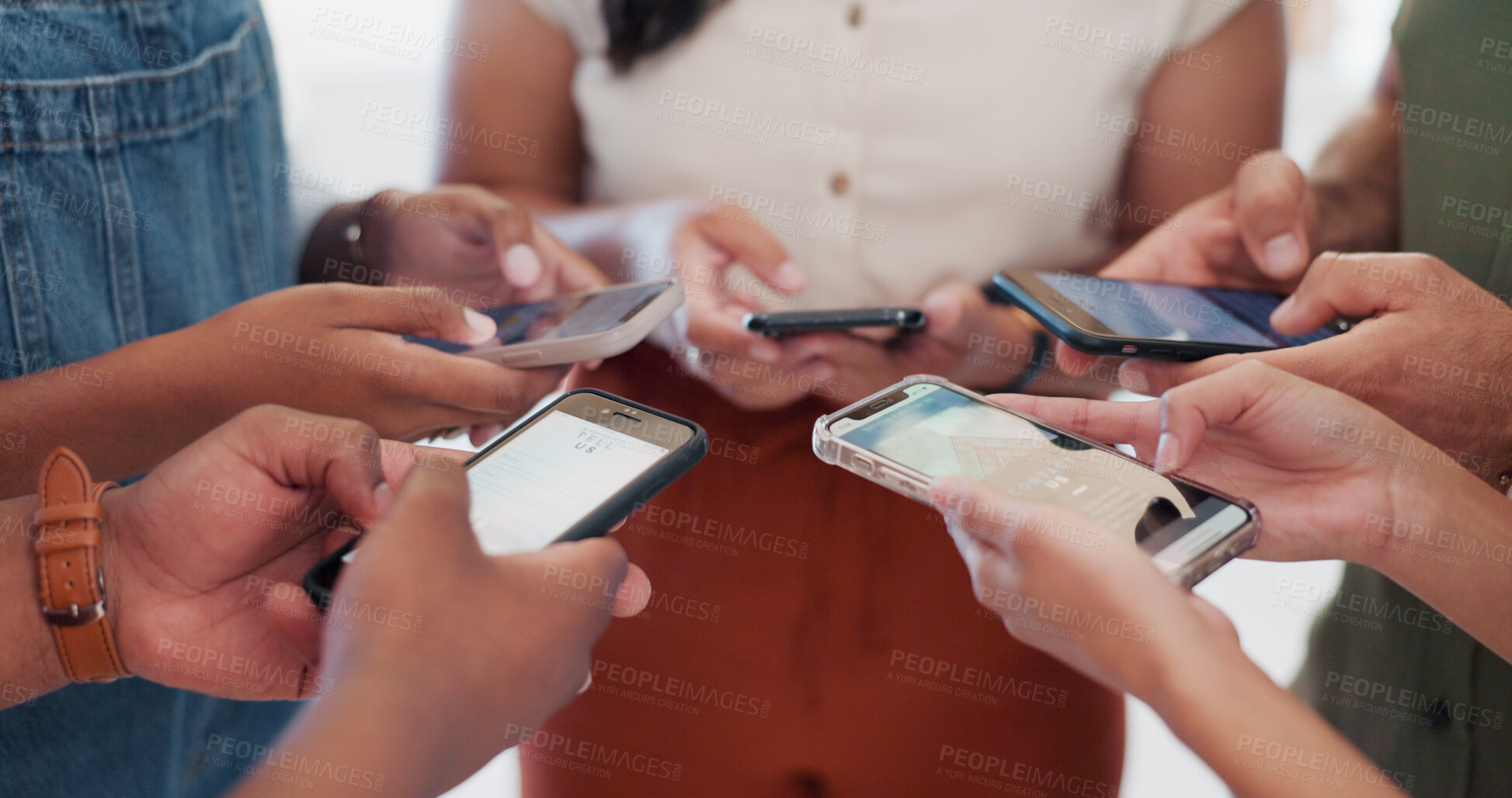 Buy stock photo Creative people, phone and hands in social media, networking or communication together in circle at office. Closeup of employee group on mobile smartphone for online chatting and data sync in startup