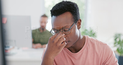 Stress, anxiety and mental health with a business black man removing his glasses while suffering from a headache at work. Burnout, frustration and migraine with a male employee working in his office
