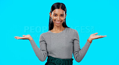 Buy stock photo Comparison and what hands of happy woman portrait with choice in a studio with question or idea emoji gesture. Decision, promo and female person with option, balance or scale with blue background