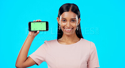 Buy stock photo Portrait, woman and mockup green screen of phone for advertising, about us or offer in studio. Indian model, mobile newsletter and information of promotion, ads or deal coming soon on blue background