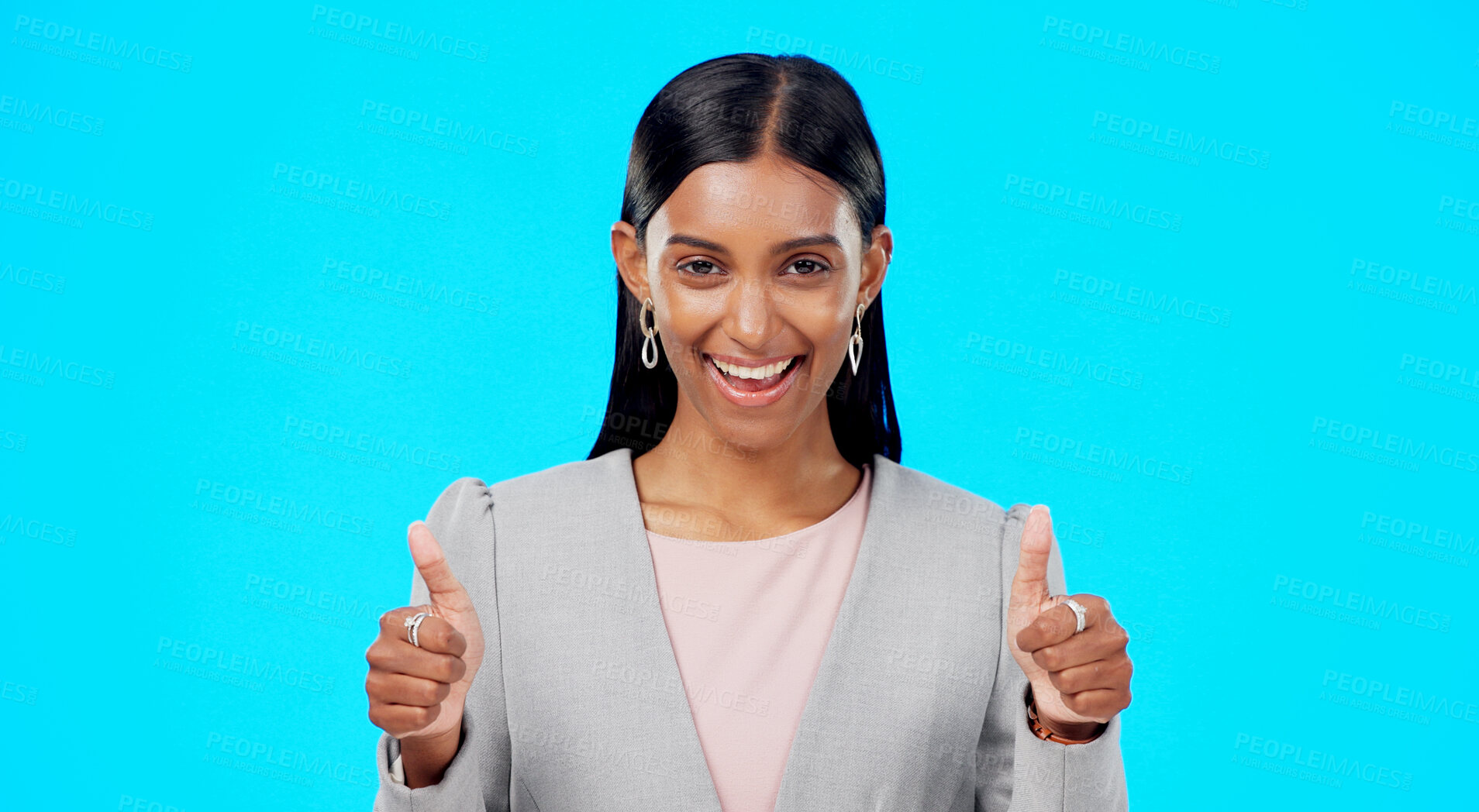 Buy stock photo Thumbs up, business and portrait of happy Indian woman on blue background for promotion, thank you or deal. Mockup, emoji and face of worker with hand gesture for approval, agreement or yes in studio