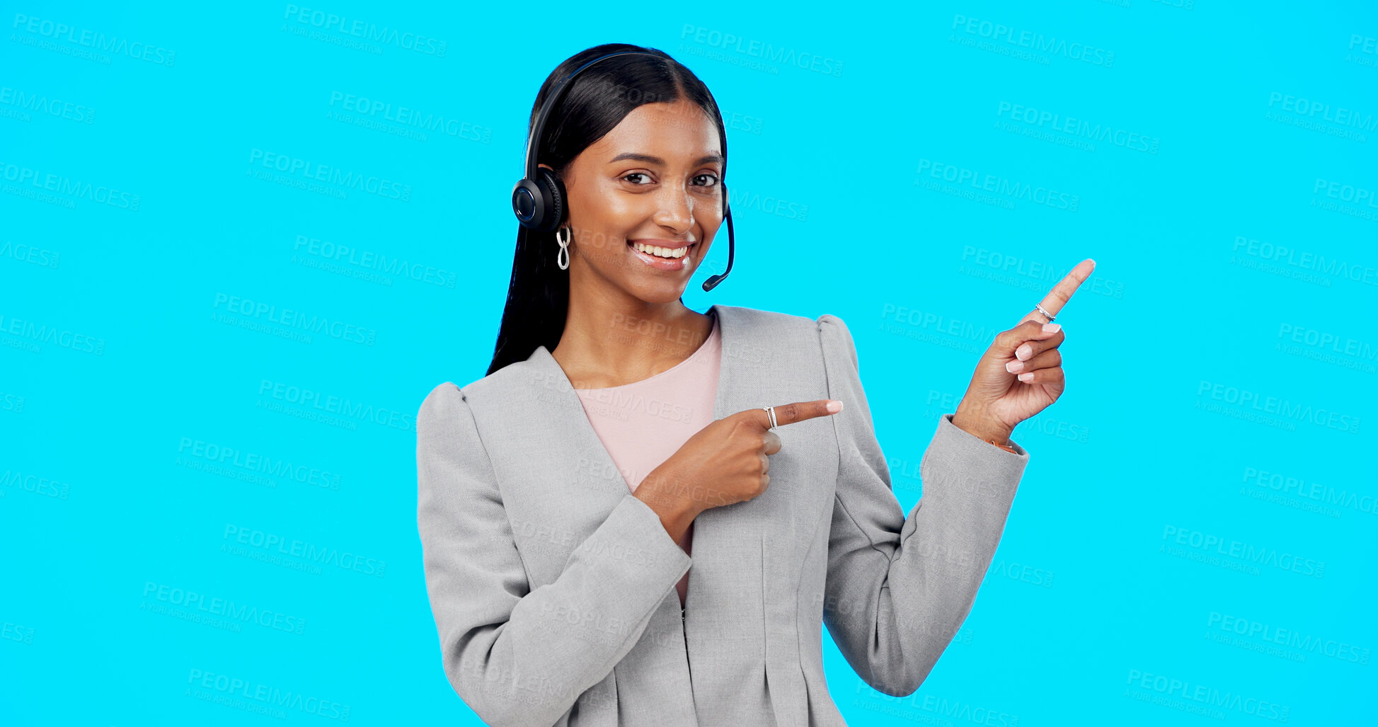 Buy stock photo Call center portrait, professional happy woman and pointing at telemarketing info, telecom choice or advisory service. Customer support info, contact us and studio help desk agent on blue background