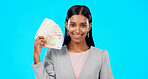 Rich, portrait or excited Indian woman with money success on blue background in studio with smile. Wealthy, finance or happy girl with cash profit, lottery jackpot or euros by winning a bonus prize