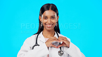 Buy stock photo Woman doctor, heart hands and face in studio, blue background and love emoji sign. Portrait, female person and model with a smile from healthcare and wellness hope and happy from career trust and job