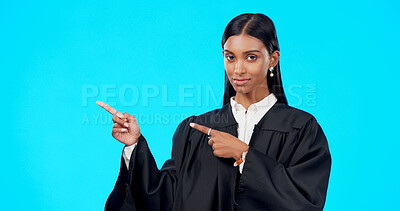 Portrait mockup or woman lawyer pointing in studio for product placement, advertising or marketing. Mockup space, legal job or Indian girl attorney showing promotion offer or deal on blue background