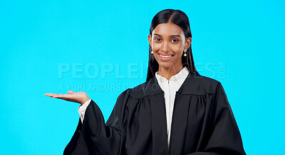 Portrait mockup or woman lawyer in studio for product placement, advertising or marketing. News announcement space, legal job or Indian girl attorney showing promotion sales offer on blue background
