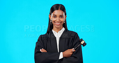 Buy stock photo Happy woman, portrait and lawyer with gavel for judge, legal attorney or justice against a blue studio background. Female person smile with arms crossed in confidence for constitution or human rights