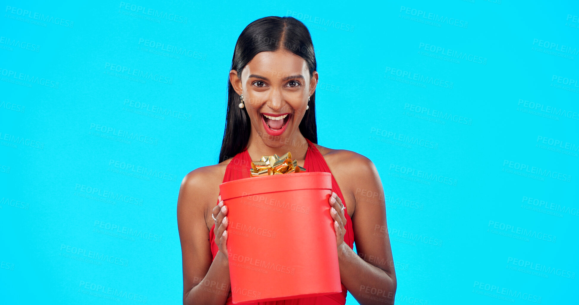 Buy stock photo Woman, valentines day gift box and studio portrait with wow, surprise and happy by blue background. Girl, present or giveaway prize with container, package and excited face for date, love or romance