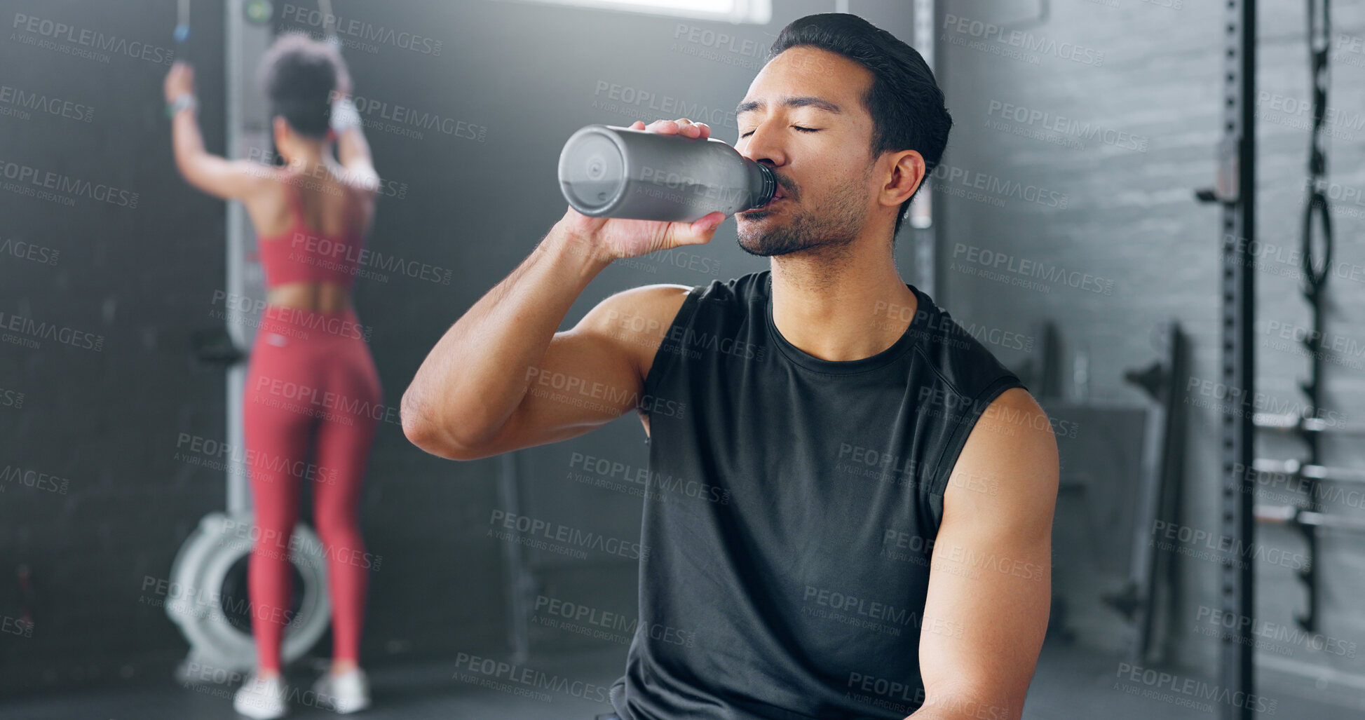 Buy stock photo Asian man, fitness and drinking water on break at gym after workout, training or indoor exercise. Active or sporty male person with mineral drink in rest for diet, natural nutrition or sustainability