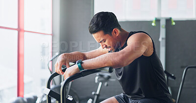 Buy stock photo Man, gym and tired with cycling, training and thinking with breathing, vision and health with rest on bike. Person, bicycle and spin class with workout, ideas or burnout with cardio to lose weight