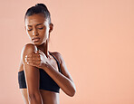 Fitness trainer, wellness nutritionist wears sunscreen in sportswear on world health day on paper background. Worried girl exercising wants liposuction, cosmetic surgery or vaccine injection.