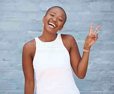Buy stock photo Portrait, hand and peace sign with a business black woman on a blue brick wall with a smile. Hand, emoji and motivation with a female employee showing a v gesture while feeling positive or confident