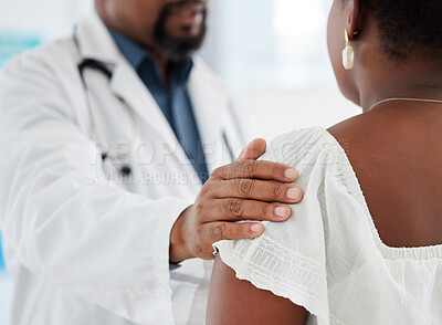 Doctor touching a patient on the shoulder in support. Closeup on hand of doctor being kind to a patient in a checkup. Medical gp offering a patient comfort during a consult cropped.