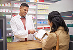Pharmacy, medication and pharmacist explaining a prescription to a female patient in a chemist. Pharmaceutical, dispensary and male healthcare worker talking about medicine to a woman in a drug store