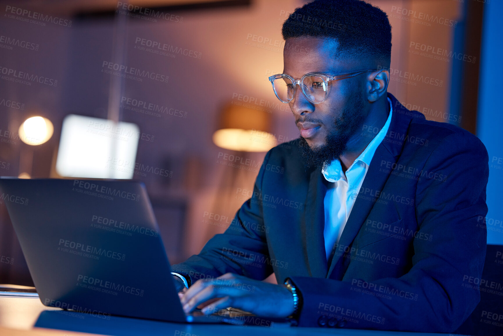 Buy stock photo Black man, laptop and typing, businessman focus with coding or writing report, information technology and data analysis. Email, networking and research, programmer and software upgrade at night