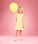 Girl, child and portrait with a balloon in studio on a pink background with a smile and full body. Female kid model with happiness, creativity and yellow icon in hand isolated on  color and space
