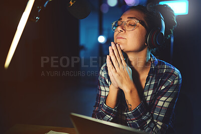 Buy stock photo Radio dj, presenter pray and woman in a sound production studio taking praying break at work. Headphones, recording and thinking female employee ready for discussion on air for web podcast and music