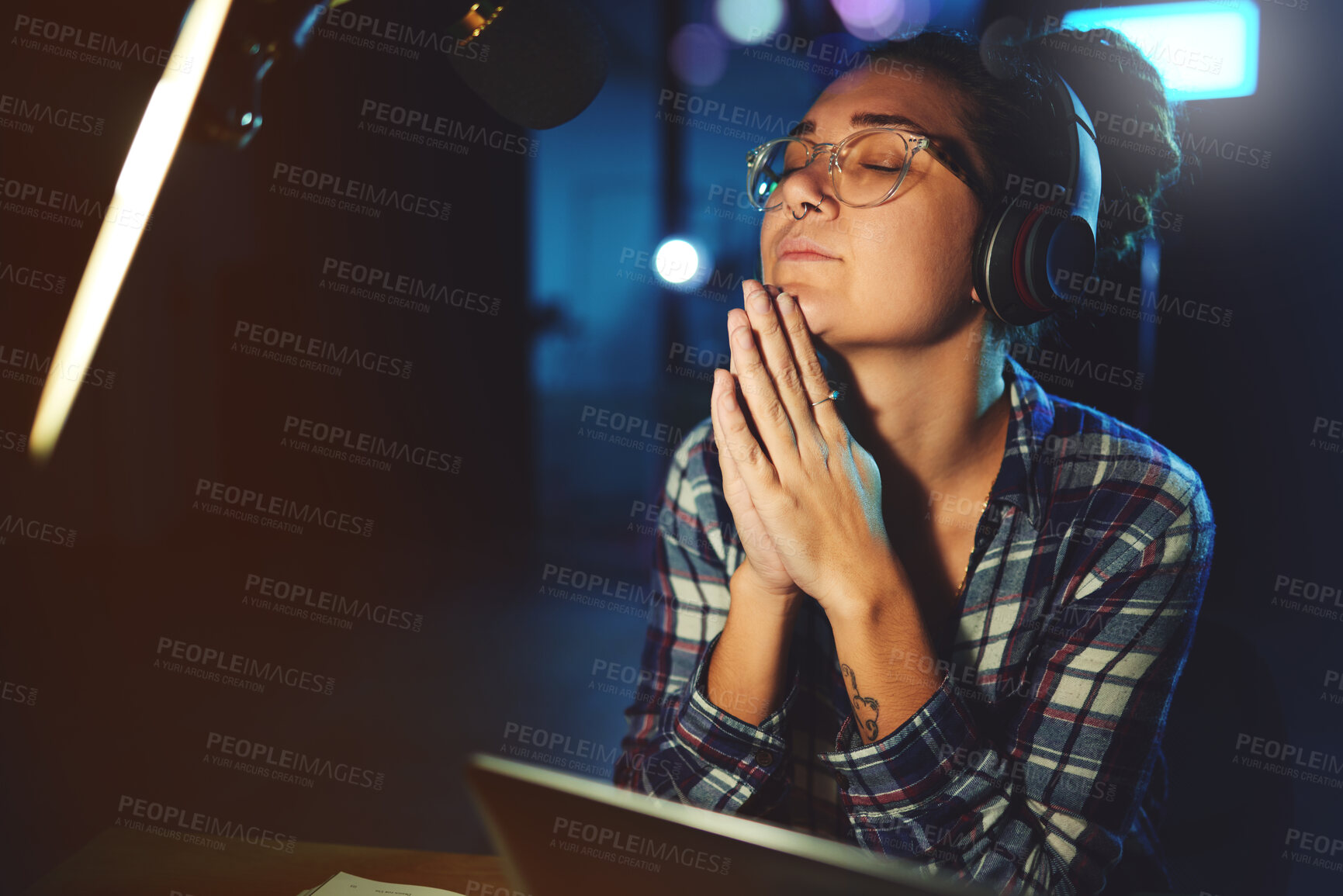 Buy stock photo Radio dj, presenter pray and woman in a sound production studio taking praying break at work. Headphones, recording and thinking female employee ready for discussion on air for web podcast and music