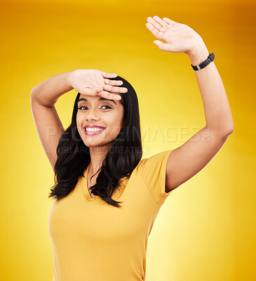 Buy stock photo Happy, shy and cover with portrait of woman in studio for excited, surprise and cool. Smile, happiness and creative with female and arm stretching on yellow background for hiding, break and relief