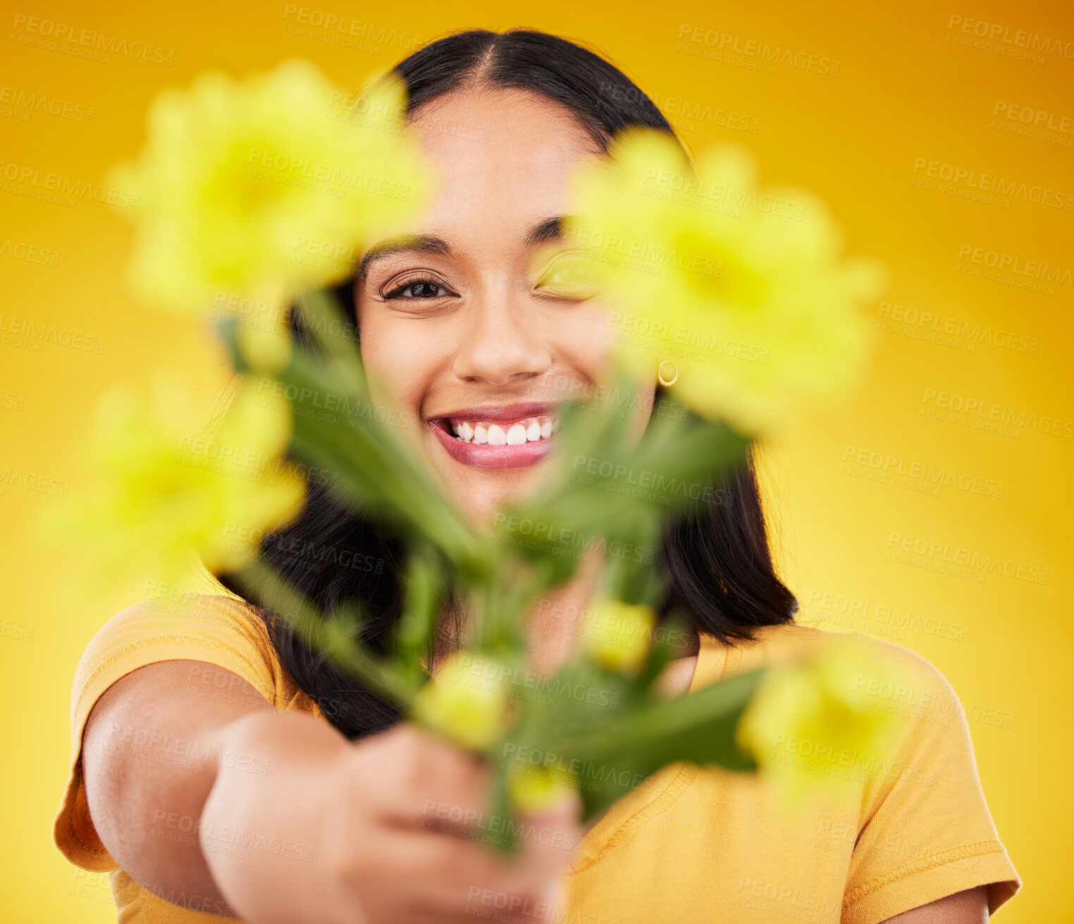 Buy stock photo Happy, portrait and a woman showing flowers isolated on a yellow background in a studio. Floral, spring and a girl giving a bouquet as a present, sharing plants and fresh flower with a smile