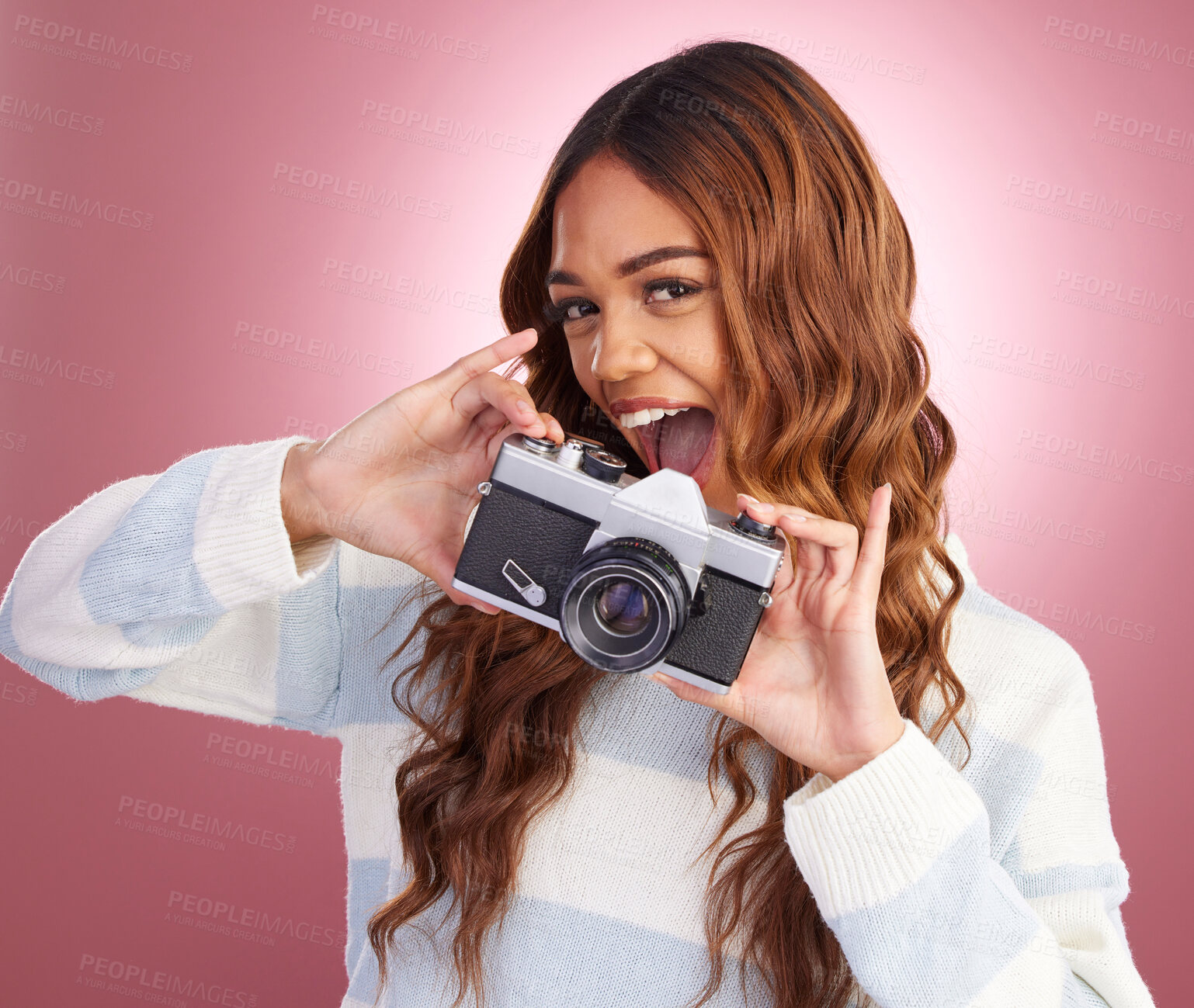 Buy stock photo Portrait, photographer and woman in studio with camera, happy and excited while posing on pink background. Face, person and girl with lens having fun, cheerful and pose for picture or photo