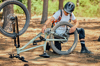 Buy stock photo Maintenance, fitness and a man with a bicycle for cycling, fixing a wheel or tire in nature. Training, cardio and a cyclist repairing a bike, doing repairs and inspection for a race or competition