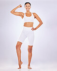 Health, skincare and woman flex muscle for strong body, wellness and exercise on studio background. Beauty, fitness and portrait of happy girl flexing in underwear for workout, diet and weight loss