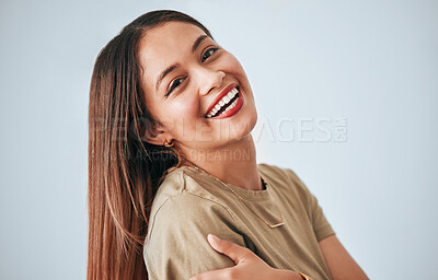 Buy stock photo Woman is laughing, happiness and portrait with confidence isolated on studio background, comedy and carefree. Happy, young female and joy with laugh, funny and mockup with humor and positive smile