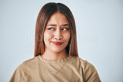 Buy stock photo Thinking, doubt and question with a woman on a gray background in studio looking for an answer. Idea, confused and opinion with an attractive young female feeling thoughtful while contemplating 