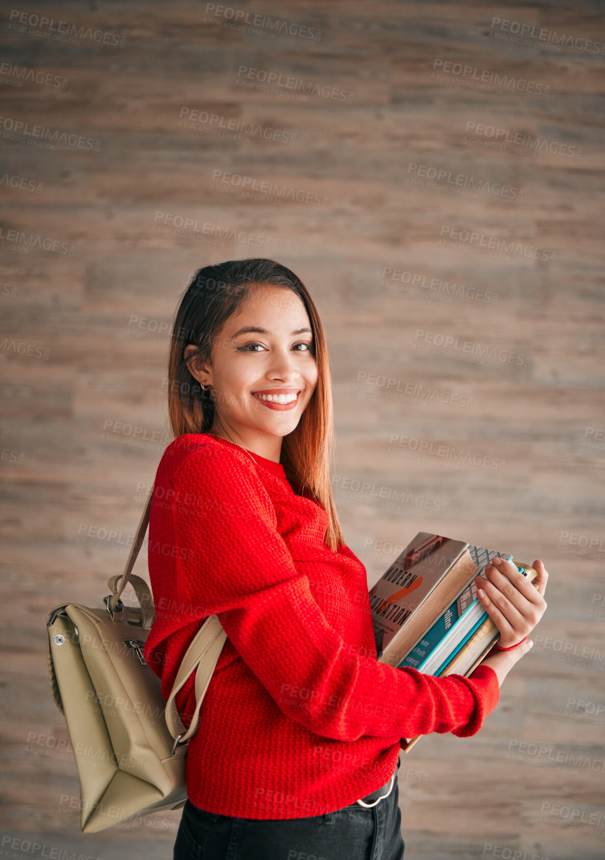 Buy stock photo Portrait, books and education with a student woman on a wooden background for learning at college or university. School, study and scholarship with an attractive young female pupil wearing a backpack
