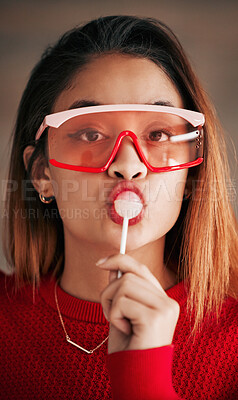 Buy stock photo Portrait, fashion and woman with lollipop, glasses and confidence with stylish outfit, edgy and trendy. Face, female and lady with sweets, candy and funky eyewear with cool clothes and creativity