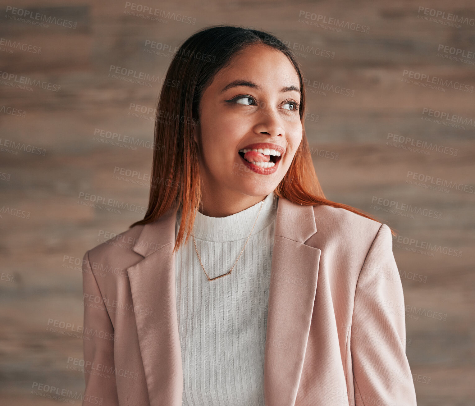 Buy stock photo Happy, beautiful and female with her tongue out by a wall with a positive, goofy and confident mindset. Happiness, comic and excited young woman model from Mexico with a silly funny face expression.