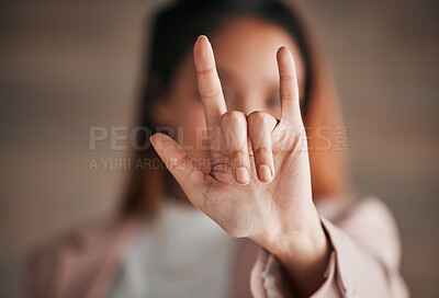 Buy stock photo Hand, sign language and love with a person closeup in studio on a blurred background for communication. Emoji, icon or affection and an adult indoor to gesture romance with a fingers icon signal