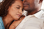 Love, comfort and couple rest in home for bonding, quality time and relax together in living room. Marriage, relationship and black man and woman sleeping on couch for support, peace and embrace