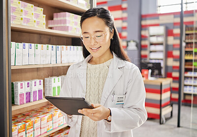 Buy stock photo Pharmacist, tablet and Asian woman in pharmacy for healthcare or online consultation in drugstore. Telehealth, technology and happy person or medical professional with touchscreen for shop research.