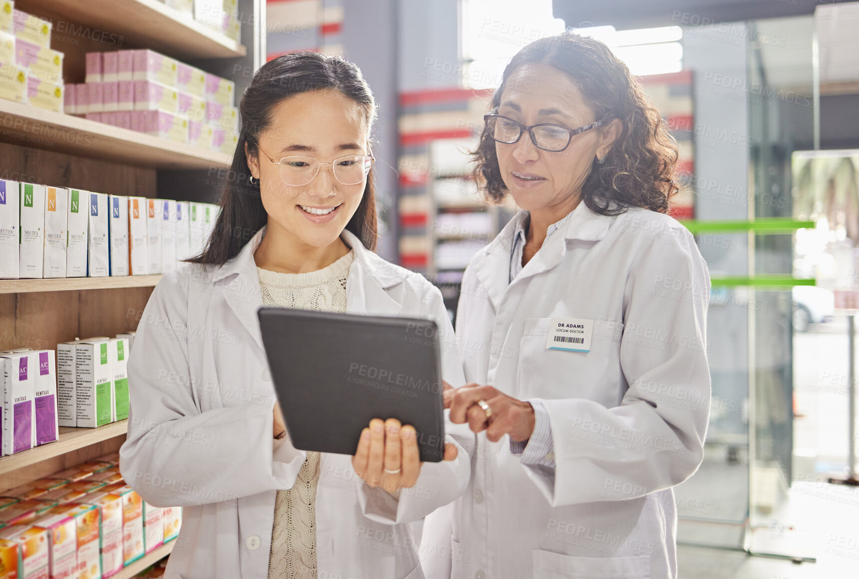 Buy stock photo Pharmacist, tablet and teamwork of women in pharmacy for healthcare, stock take or online consultation. Telehealth, collaboration or happy medical professionals in discussion of touchscreen research.