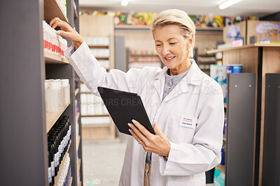 Buy stock photo Pharmacist, stock or woman with tablet, check inventory or medication information with technology. Mature female, lady or medical professional with device, pharmacy or supplements with online reading