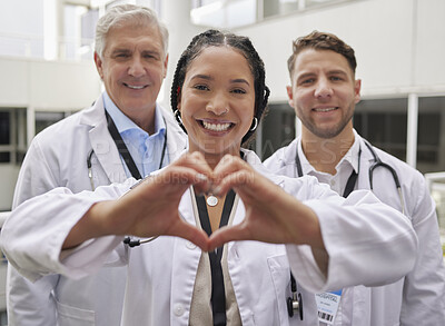 Buy stock photo Heart hand, woman doctor and portrait with a healthcare and wellness team in a hospital. Happiness, love and emoji hands gesture with doctors in a medical clinic showing solidarity and community care