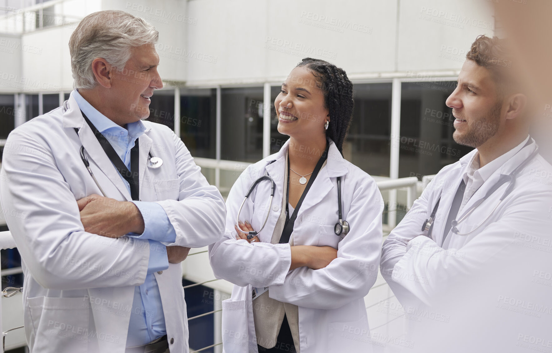 Buy stock photo Discussion, healthcare and team of doctors in the hospital talking in hallway after consultation. Collaboration, teamwork and group of professional medical workers in conversation in medicare clinic.