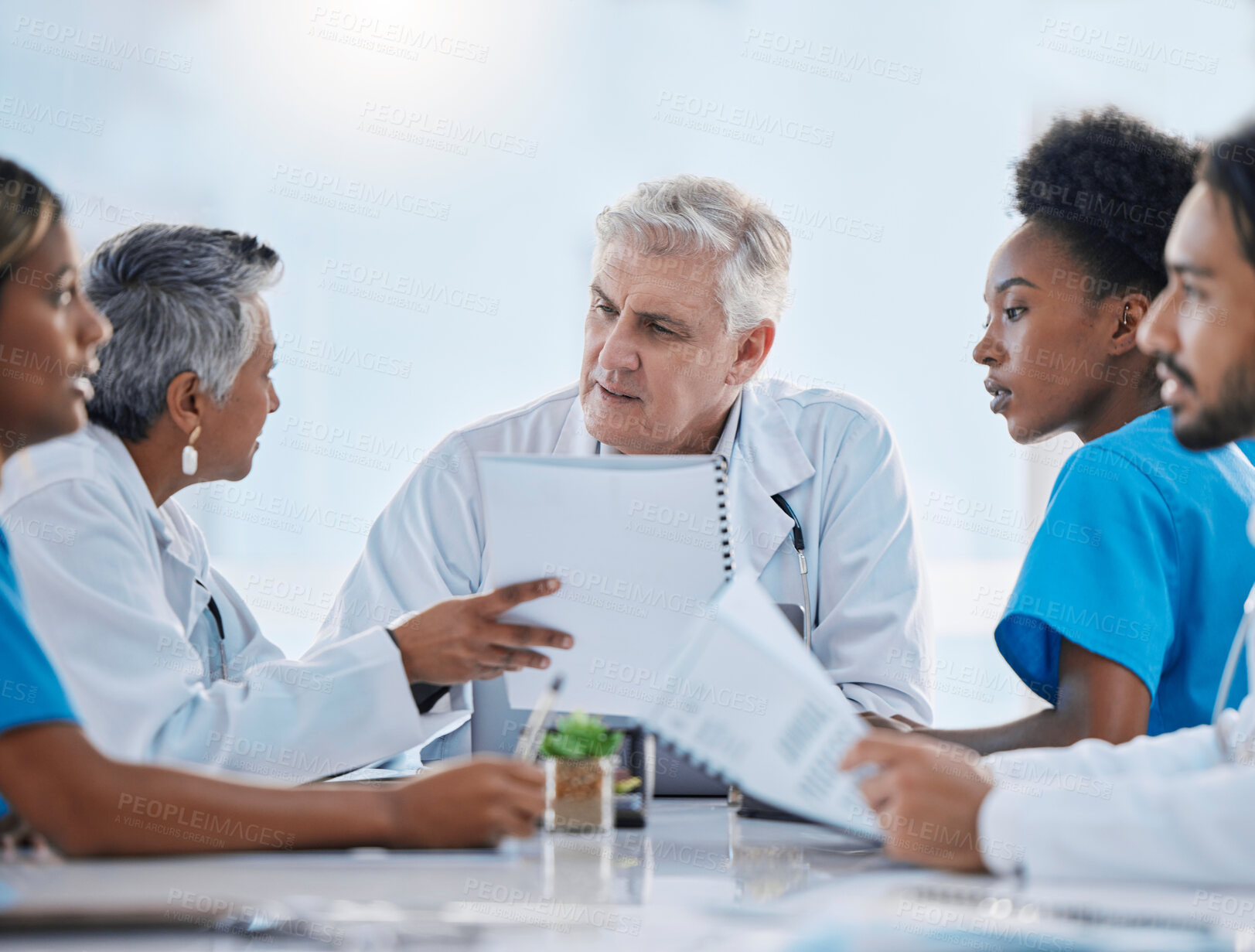 Buy stock photo Teamwork, meeting and doctors in discussion with documents for medical strategy, research and consulting. Healthcare, collaboration and people talking for insurance, planning and surgery results