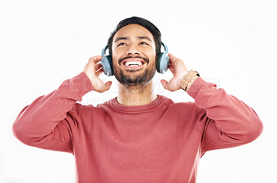 Buy stock photo Headphones, smile and music, happy man in studio isolated on white background streaming radio and happiness. Podcast subscription, technology and song, Indian guy listening to audio online to relax.