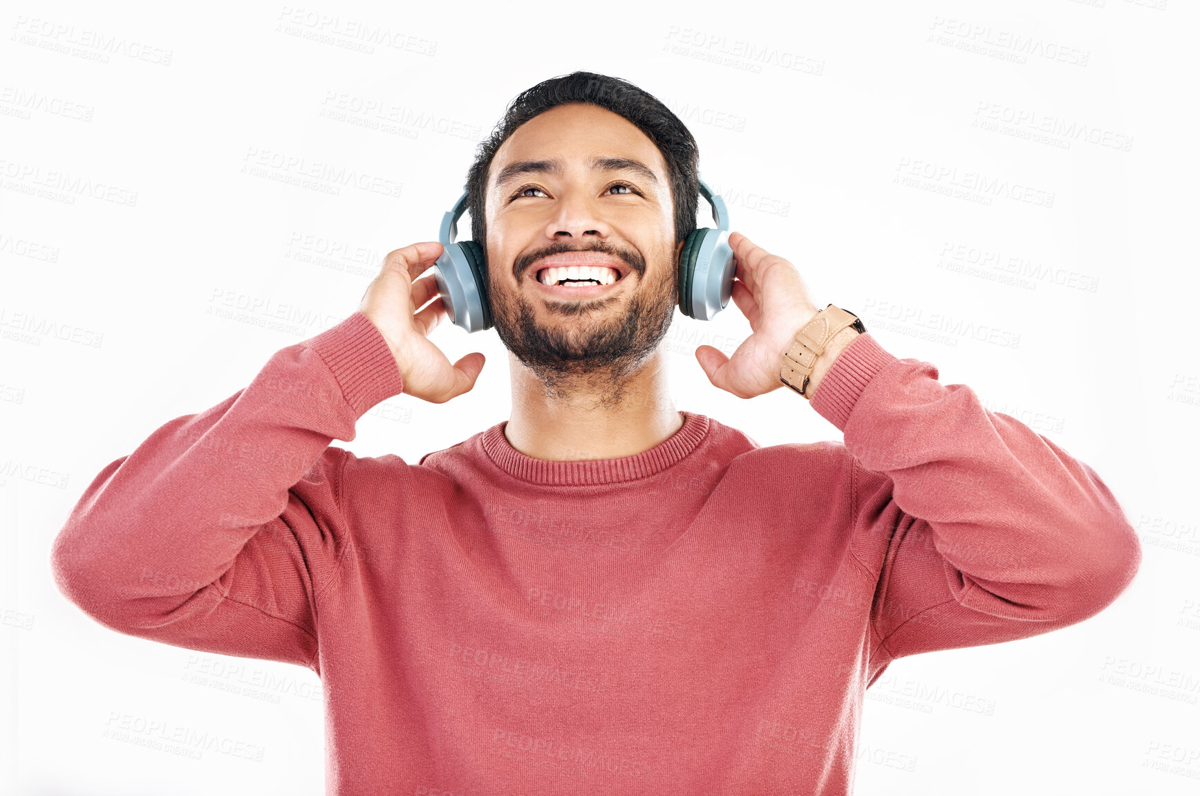 Buy stock photo Headphones, smile and music, happy man in studio isolated on white background streaming radio and happiness. Podcast subscription, technology and song, Indian guy listening to audio online to relax.