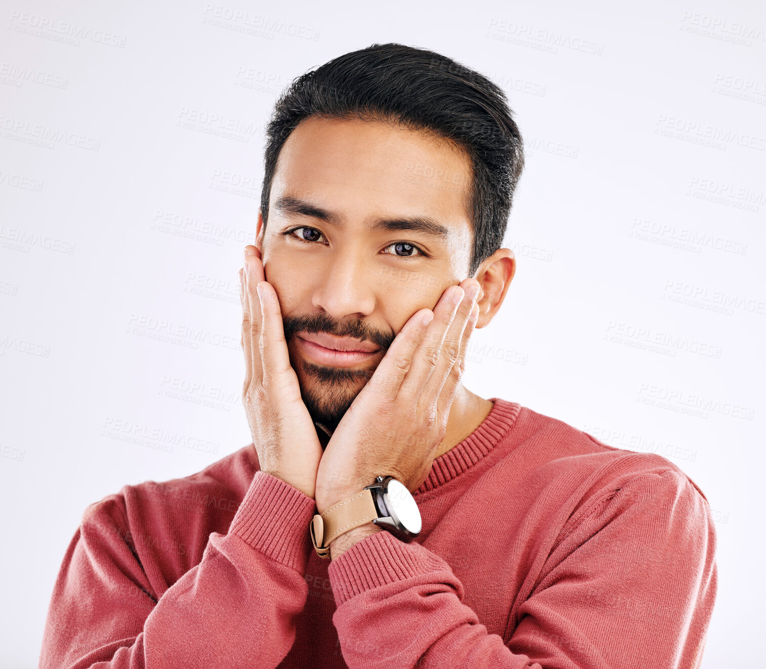 Buy stock photo Portrait, shy and in love with a man in studio isolated on a white background while touching his cheeks. Face, coy and cute with a handsome young indian male feeling special on valentines day