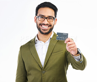 Buy stock photo Smile, credit card and portrait of man in studio with happy financial freedom and security savings. Happiness, Indian businessman with banking and saving by investing in small business startup budget