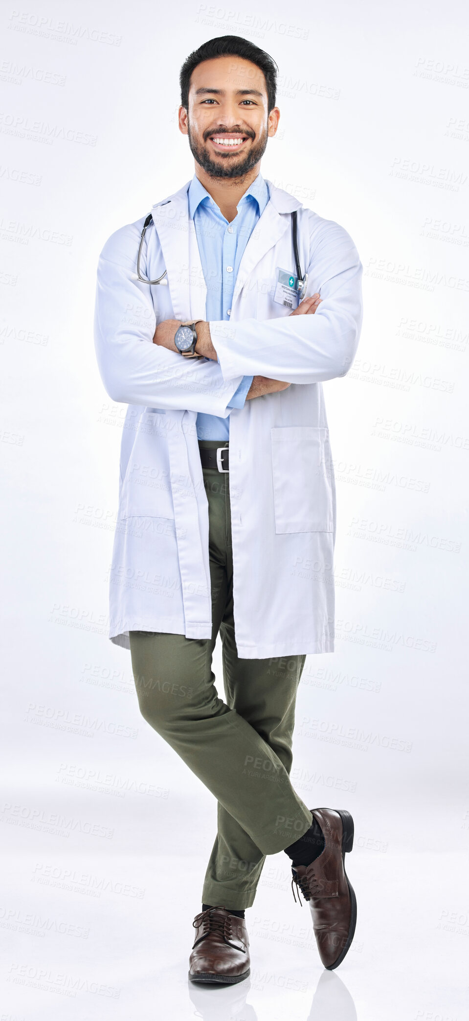 Buy stock photo Doctor, man and arms crossed in portrait with smile and confidence isolated on white background. Medical professional, happy male physician in studio and healthcare employee with success and pride