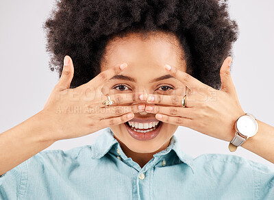 Buy stock photo Portrait, hiding face woman and smile in a studio with a person feeling playful or joking for comedy. Eyes, smile and hand gesture with a funny young female looking happy with a positive attitude