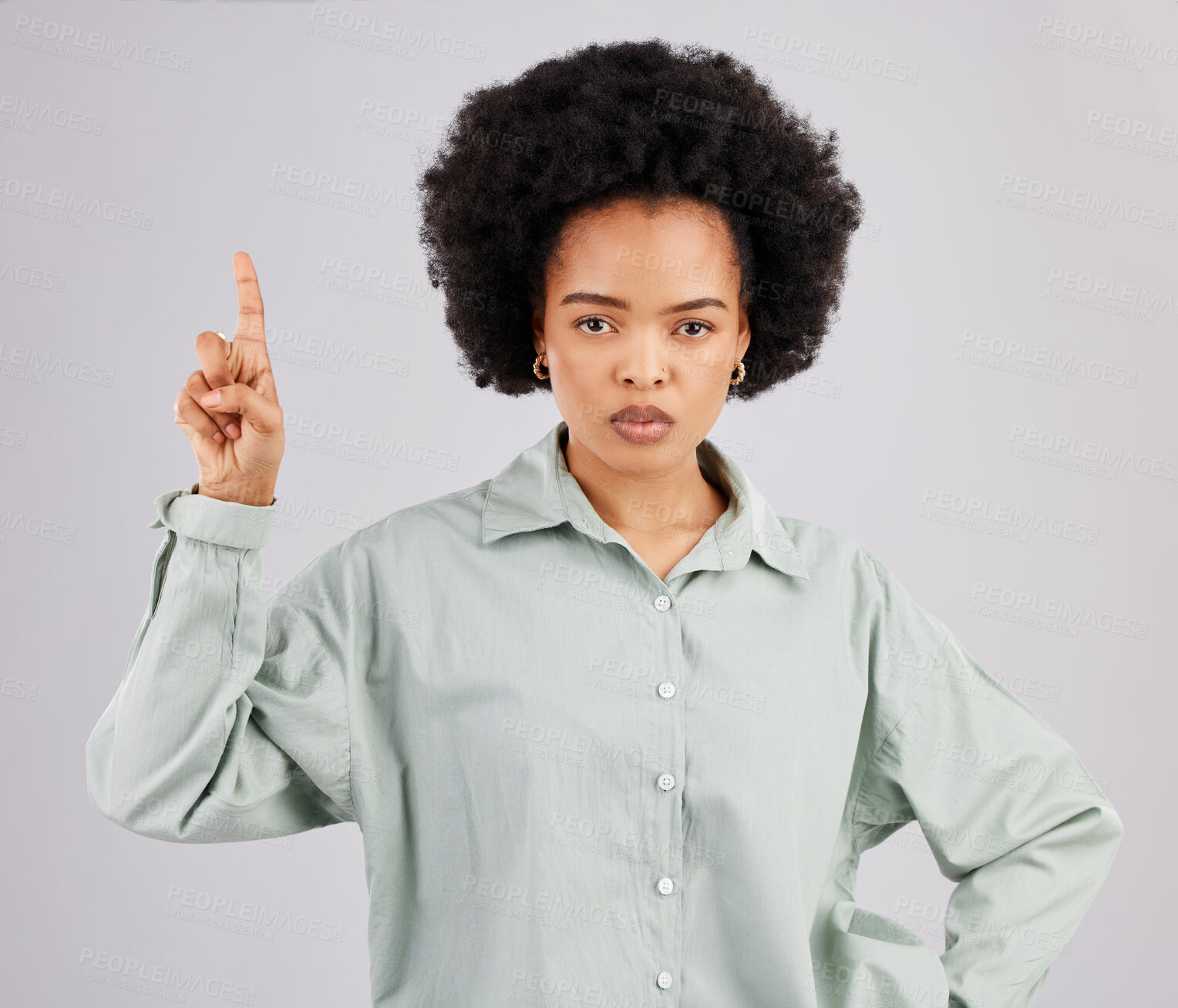 Buy stock photo Mad, pointing and portrait of black woman in studio for product placement, promotion and announcement mockup. Idea, space and  show with female on gray background for disappointed, annoyed or serious