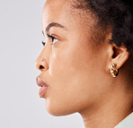 Serious, side profile and face of a black woman isolated on a white background in a studio. Focus, thinking and an African girl looking thoughtful, contemplating and taking a headshot on a backdrop