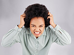 Angry, frustrated and woman portrait with hair pull with stress and burnout. Mental health, face and anger problem from female with anxiety and extreme emotion in isolated studio with grey background